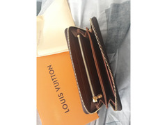 Pochette portafoglio Louis Vuitton uomo e donna