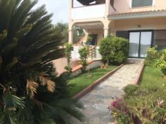 Alloggio con giardino posto auto a Budoni